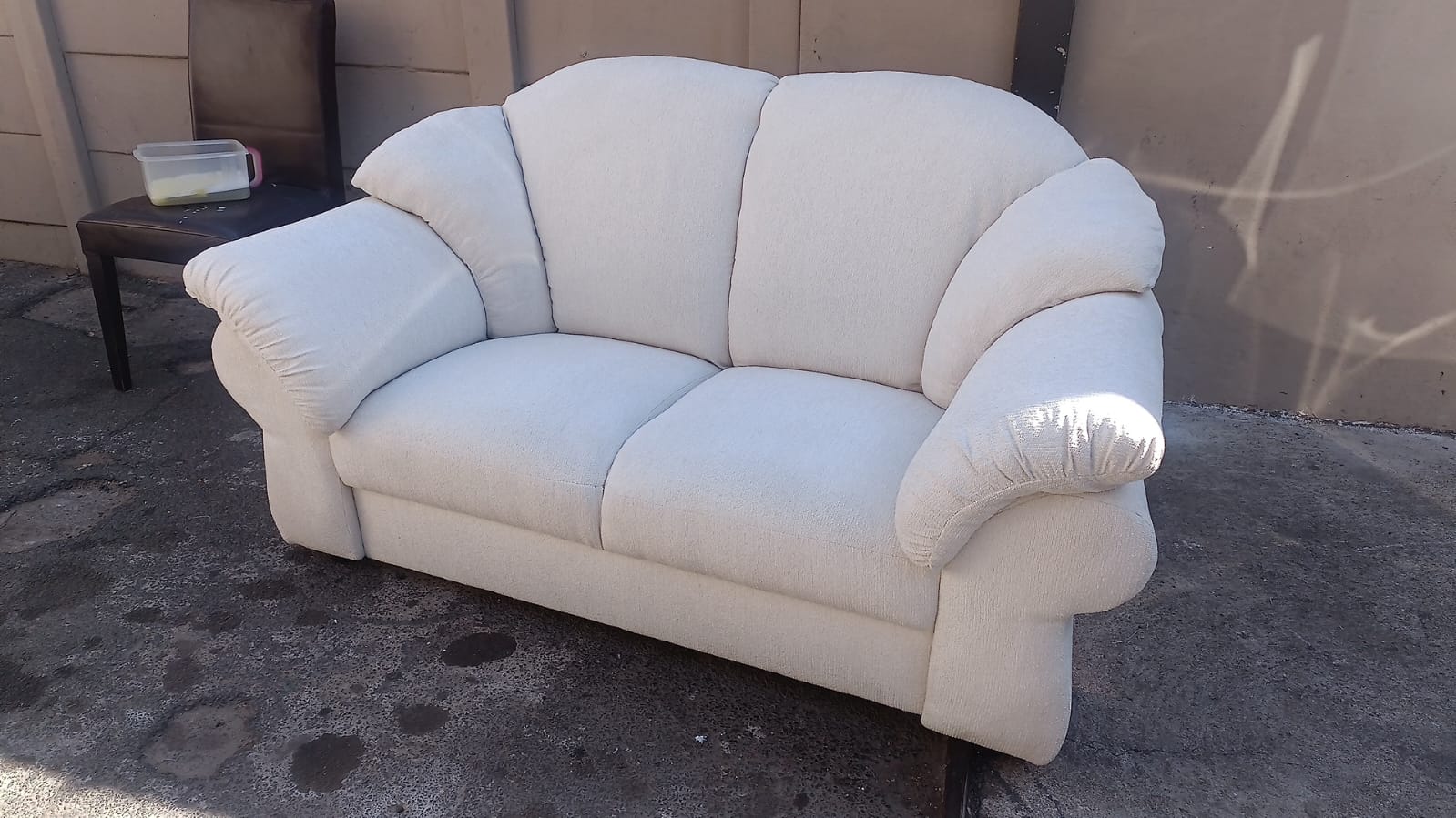 Cream fabric two-seater loveseat