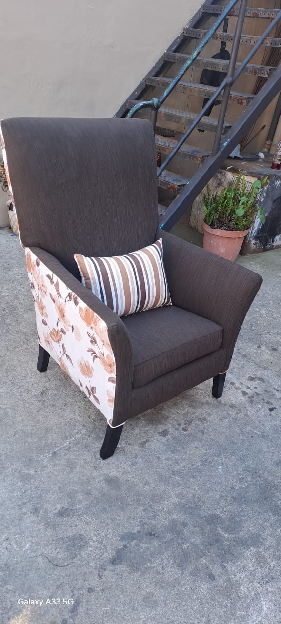Brown wingback chair with floral side panels