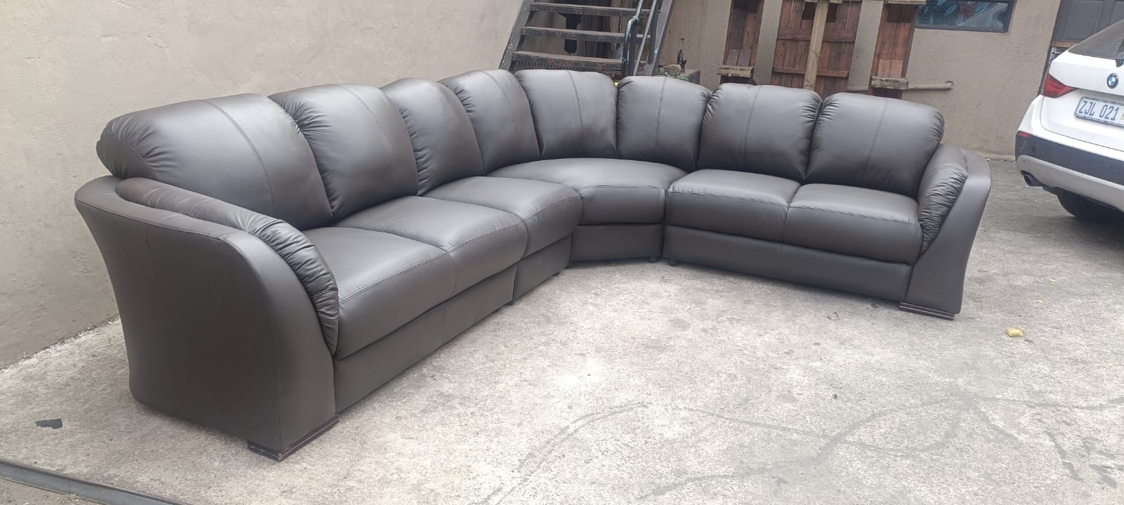 Brown leather corner lounge suite